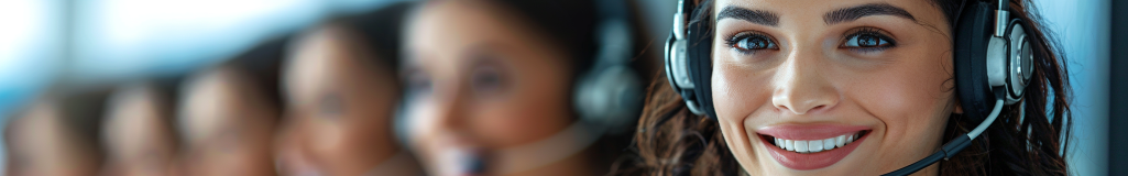 A woman wearing a headset with her face slightly blurred in the background