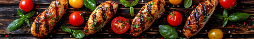 Skewered grilled chicken with fresh tomatoes and basil leaves.