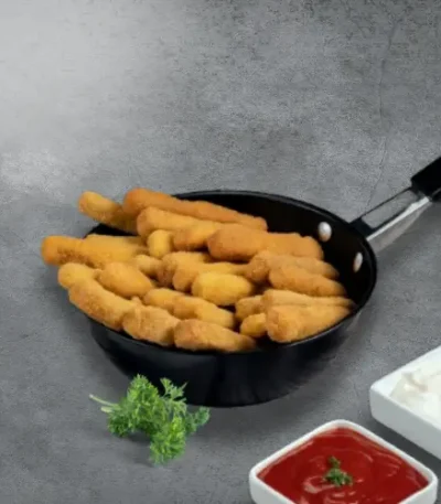 Frenchys Chicken Fries served on a pan with sauce