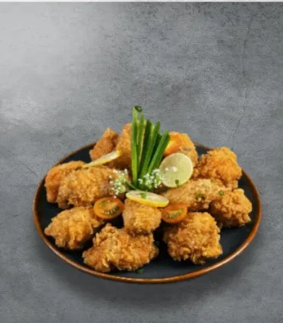 Crispy chicken cut wings served on a plate