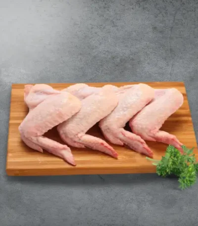 Chicken Wings on a wooden board with a pasley